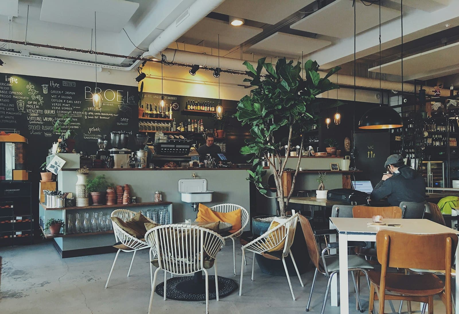 Warmly lit restaurant interior with set tables